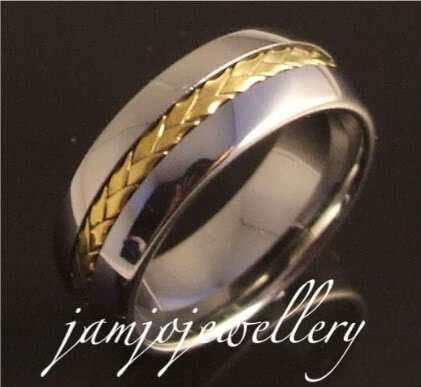 Solid tungsten band ring with wooven copper inlay.